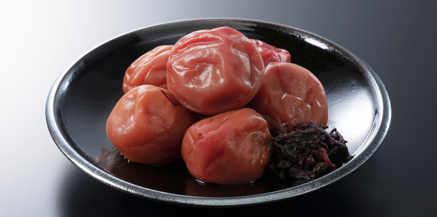 Japanese pickled plums on a black background