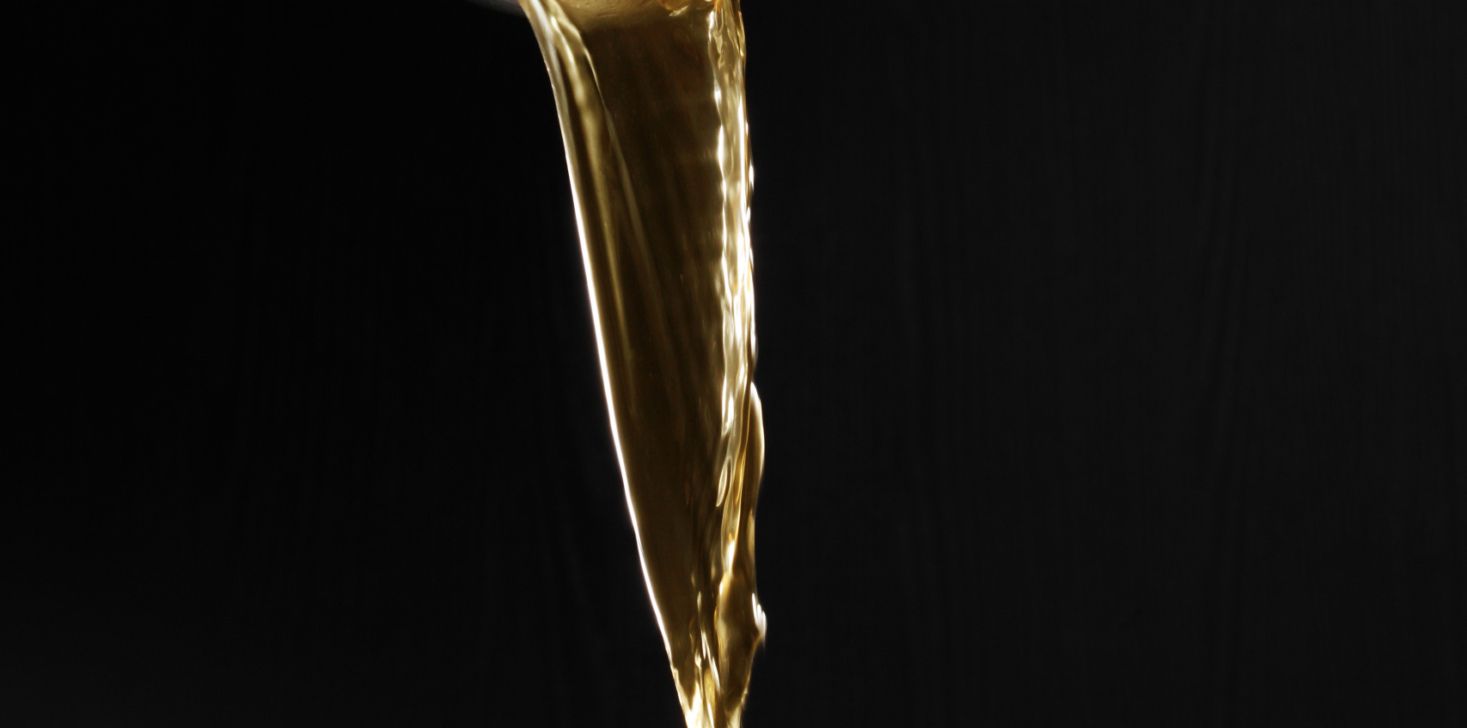 Dipper pouring noodle soup isolated on black background, Soup for sukiyaki from chicken and fish
